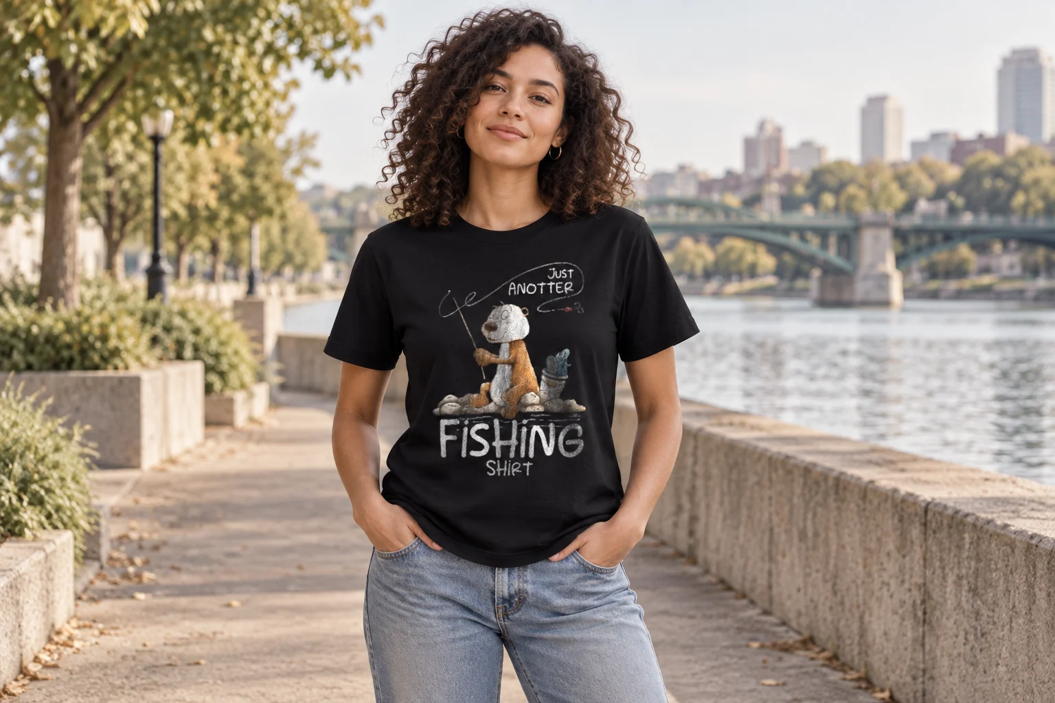 Model wearing the black fishing otter graphic T-shirt